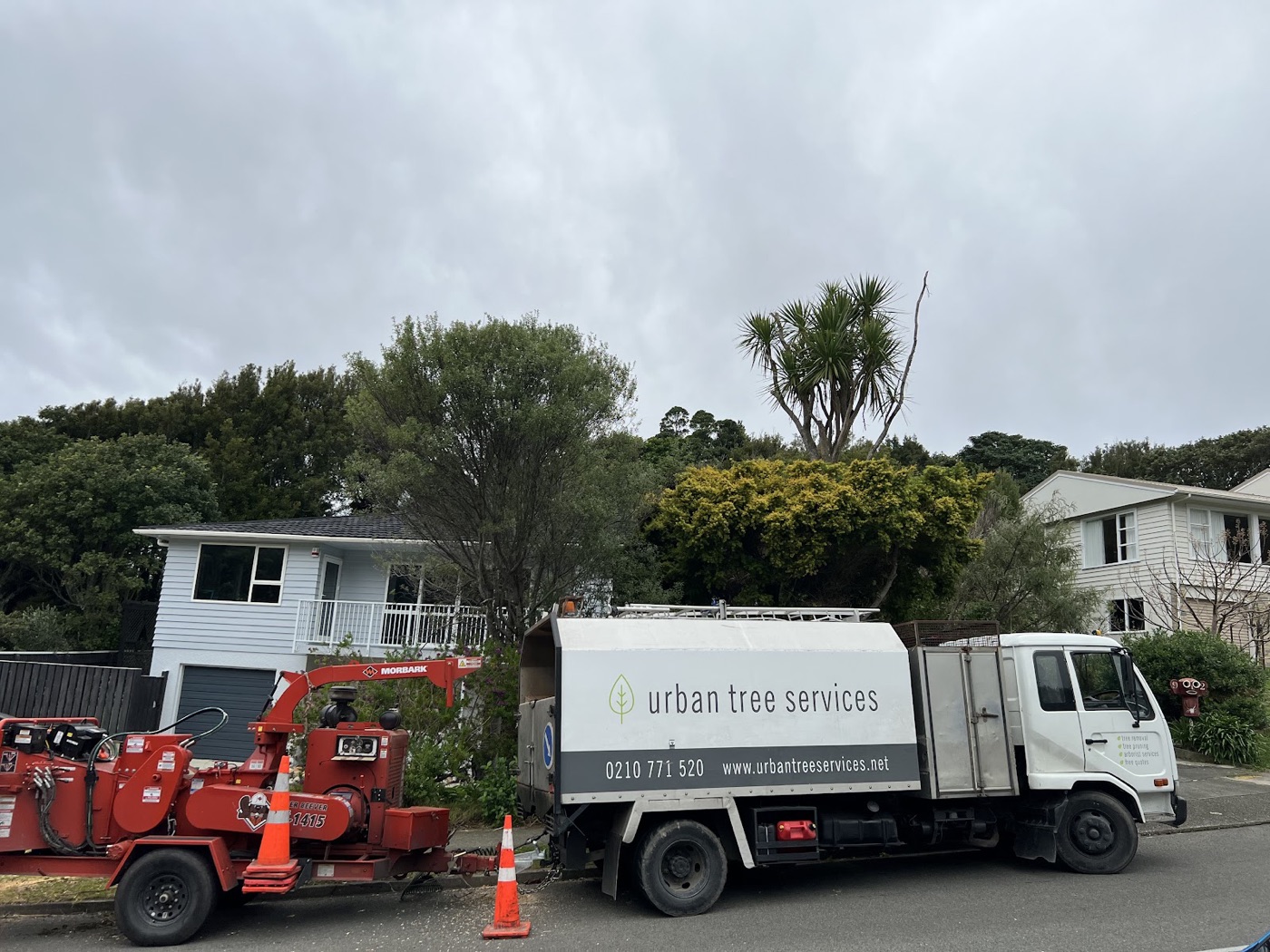 Urban Tree Services branded truck and wood chipper on a Wellington job site